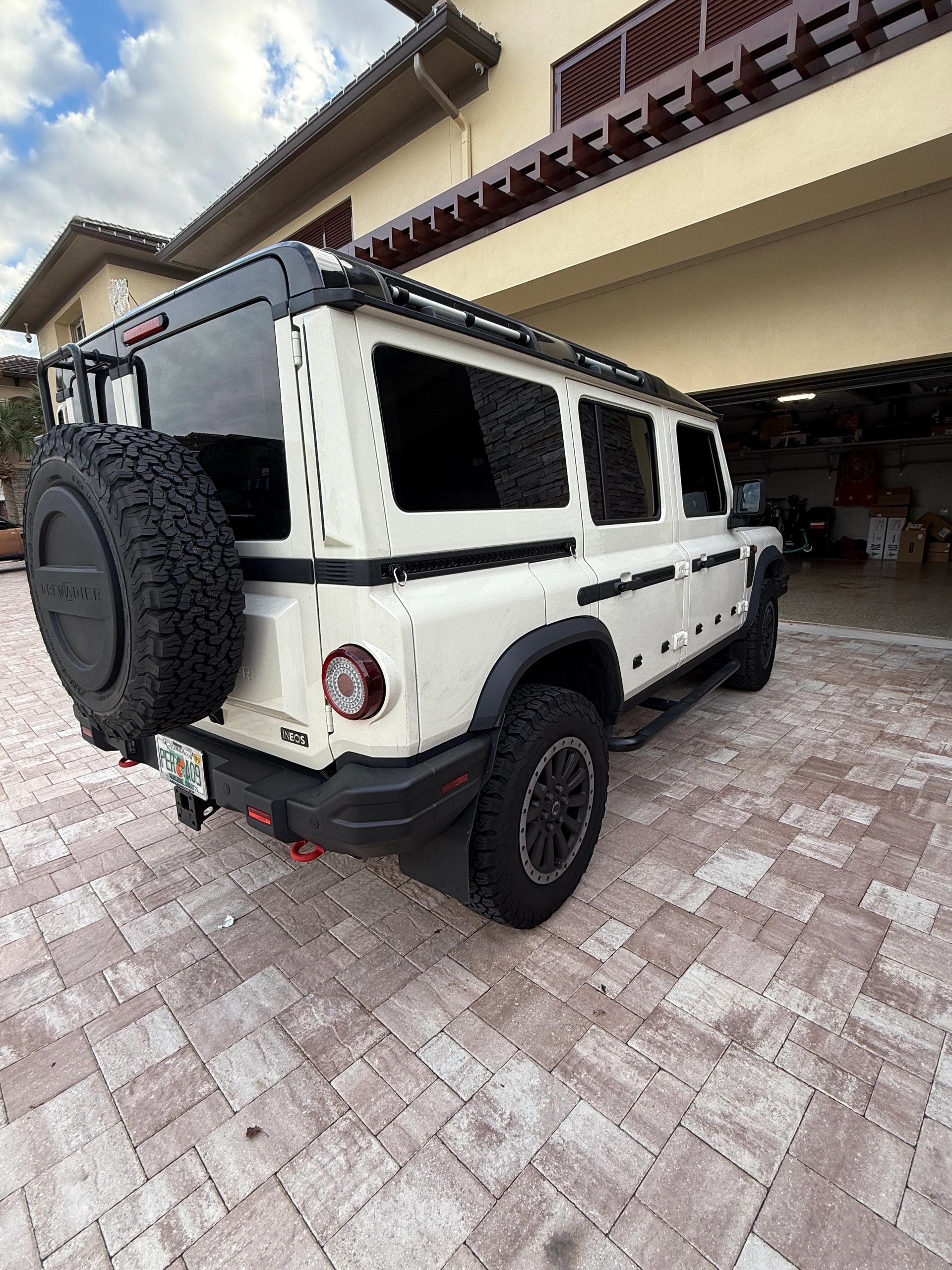 White Land Rover Defender with tinted windows