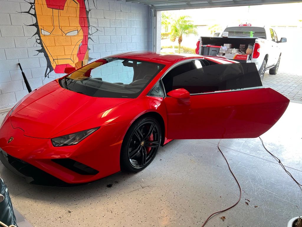 Red Lamborghini with tinted windows
