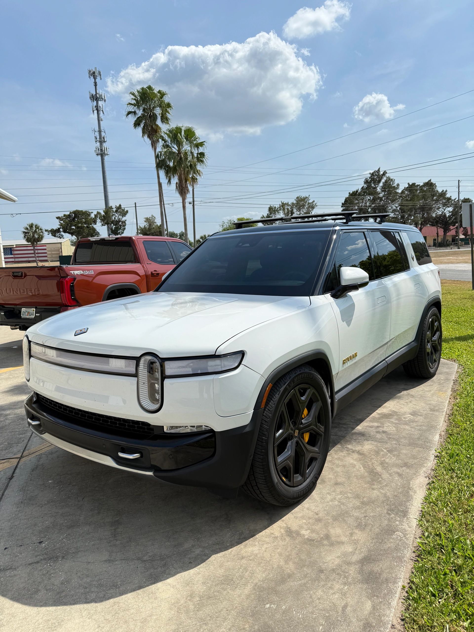 White Rivian R1S with tinted windows